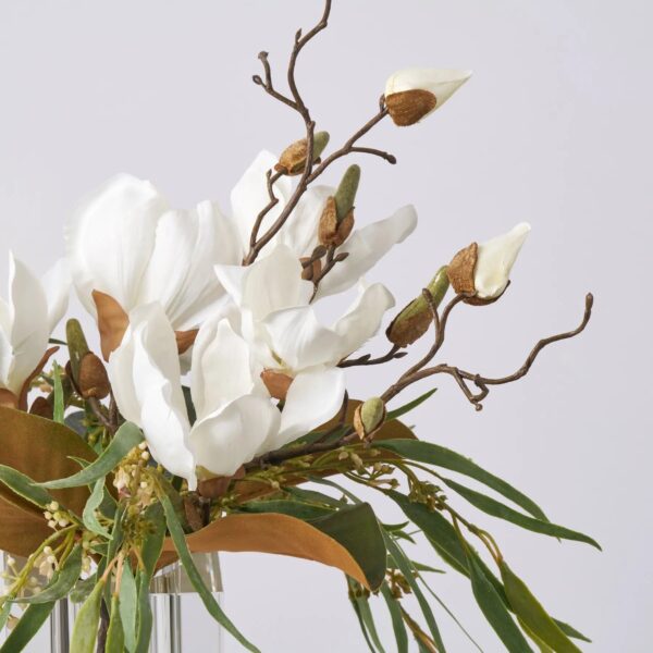 Close-up of vase silhouette detail on this Lifelike Magnolia Bloom and Leaf Water Illusion Arrangement
