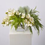 Tropical Paradise - Real Touch Cream Cymbidium Orchid, Fern, Water Illusion Arrangement