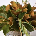 Close-up of vase silhouette detail on this Real Touch Magnolia Leaf Water Illusion Arrangement