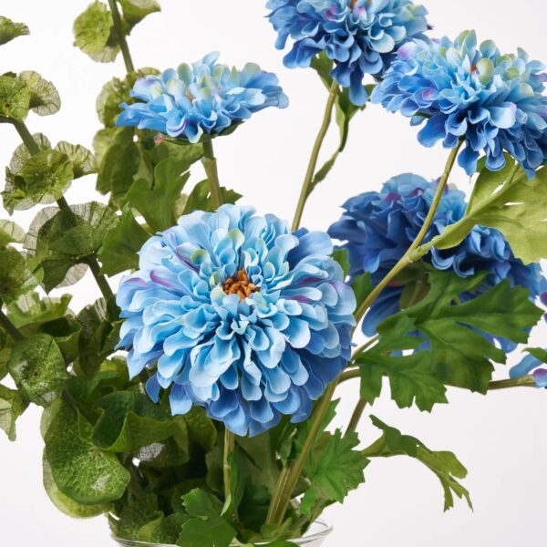 Close-up of vase silhouette detail on this Lifelike Blue Ombre Zinnia Blooms Water Illusion Arrangement
