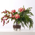 Side view of the Royal Peppermint Noel - Real Water Illusion Arrangement revealing bloom arrangement
