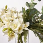Close-up of vase silhouette detail on this The Christmas Orchid - Cream Illusion Centerpiece Arrangement