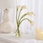 Alternate angle of the Real Touch White Calla Lily Water Illusion Arrangement showing bloom arrangement