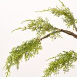 Close-up of vase silhouette detail on this Lifelike Juniper Berry Branches Water Illusion Arrangement