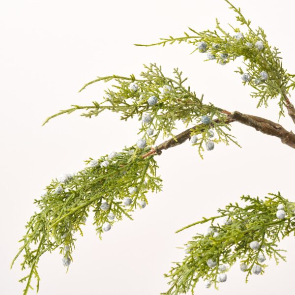 Close-up of vase silhouette detail on this Lifelike Juniper Berry Branches Water Illusion Arrangement