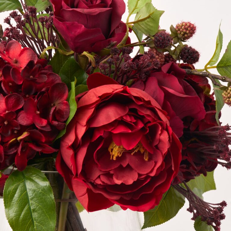 Close-up of vase silhouette detail on this Bordeaux and Berry - Red Branch Holiday Arrangement