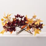 Orchid Sunset - Burgundy Orange Cymbidium Orchid and Seeding Oval Pocket Vase Water Illusion Centerpiece
