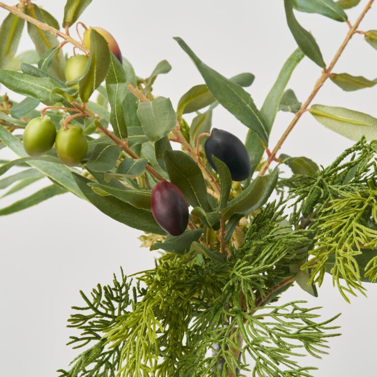 Close-up of vase silhouette detail on this Real Touch Cedar, Olive Branch Water Illusion Arrangement