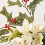 Close-up of vase silhouette detail on this Holiday Orchid Elegance - Real Water Illusion Arrangement