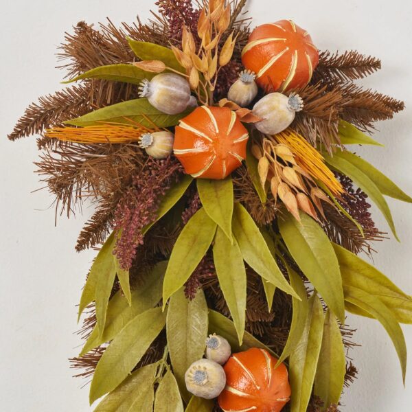 Close-up of swag tail detail on this Wild Harvest - Faux Orange, Door Hanging Swag