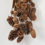 Close-up of swag tail detail on this Mixed Hanging Pinecones Christmas Decor Brown Velvet Ribbon