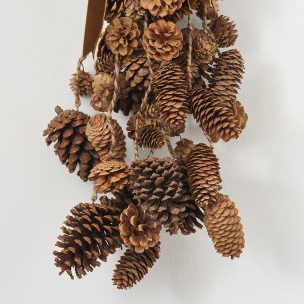 Close-up of swag tail detail on this Mixed Hanging Pinecones Christmas Decor Brown Velvet Ribbon