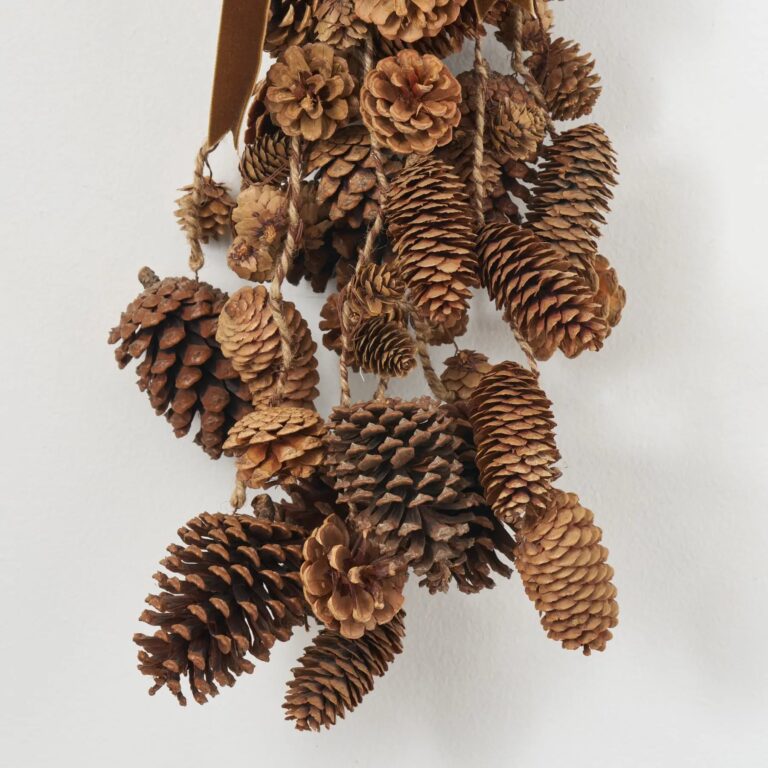 Close-up of swag tail detail on this Mixed Hanging Pinecones Christmas Decor Brown Velvet Ribbon
