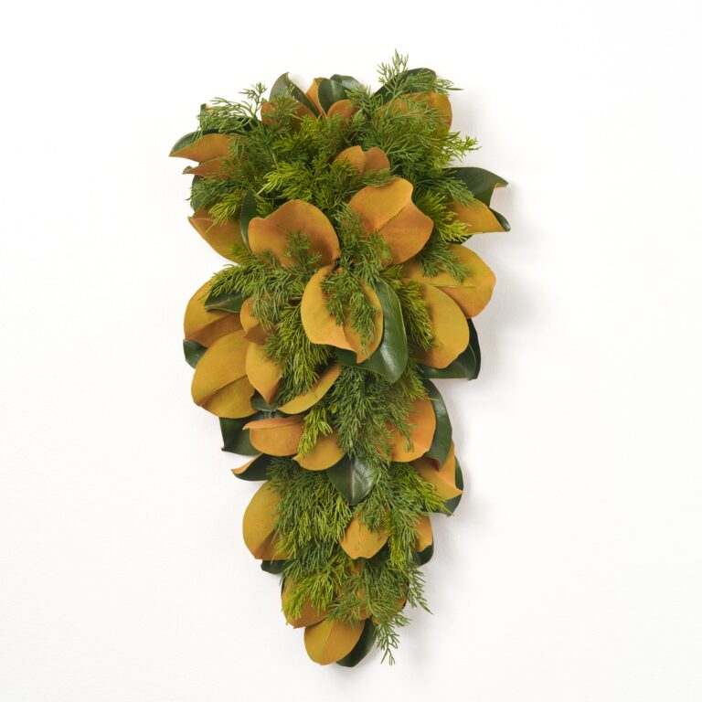 Close-up of swag tail detail on this Real Touch Magnolia Leaf Door Christmas Swag Holiday