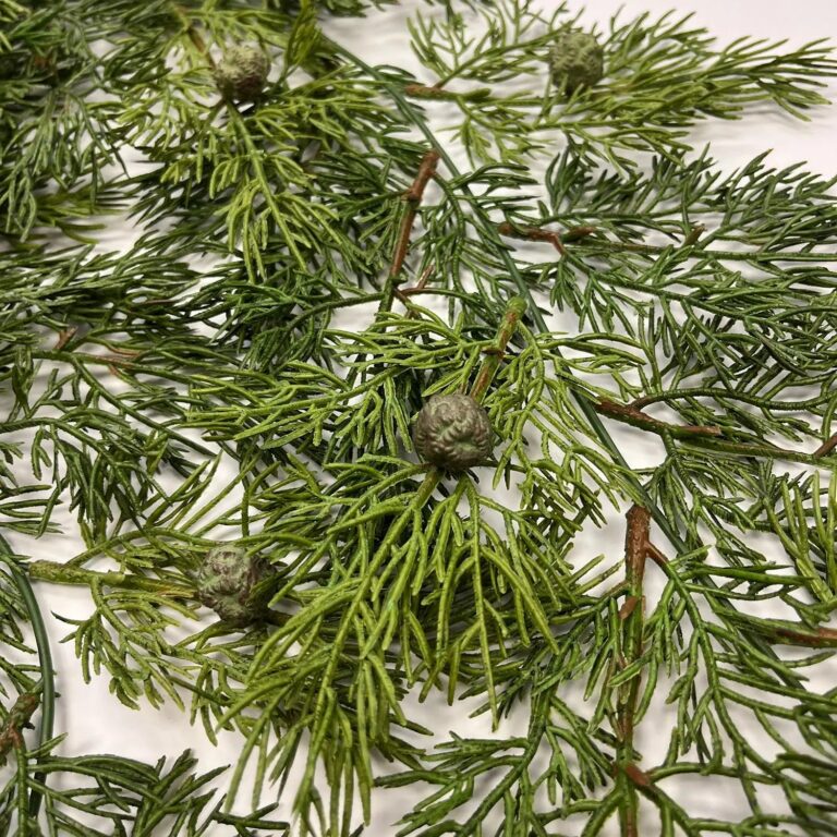 Close-up of bloom tips on this Real Touch Lux Seeding Juniper Branch Winter Bush