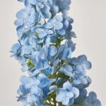 Alternate angle of the Real Touch Light Blue Pee Long Stem Spray showing leaves along