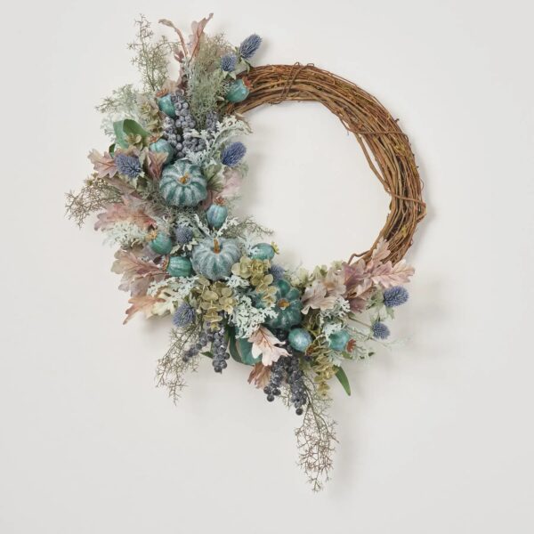 Close-up of blooms and berries on this Autumn on the Coast Front Door Wreath