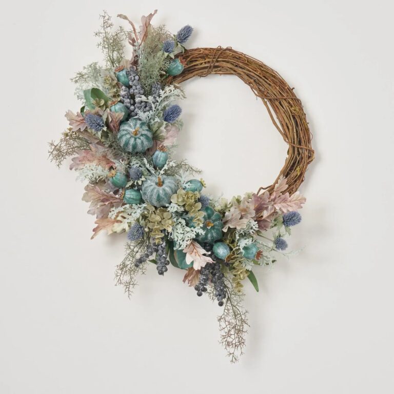 Close-up of blooms and berries on this Autumn on the Coast Front Door Wreath