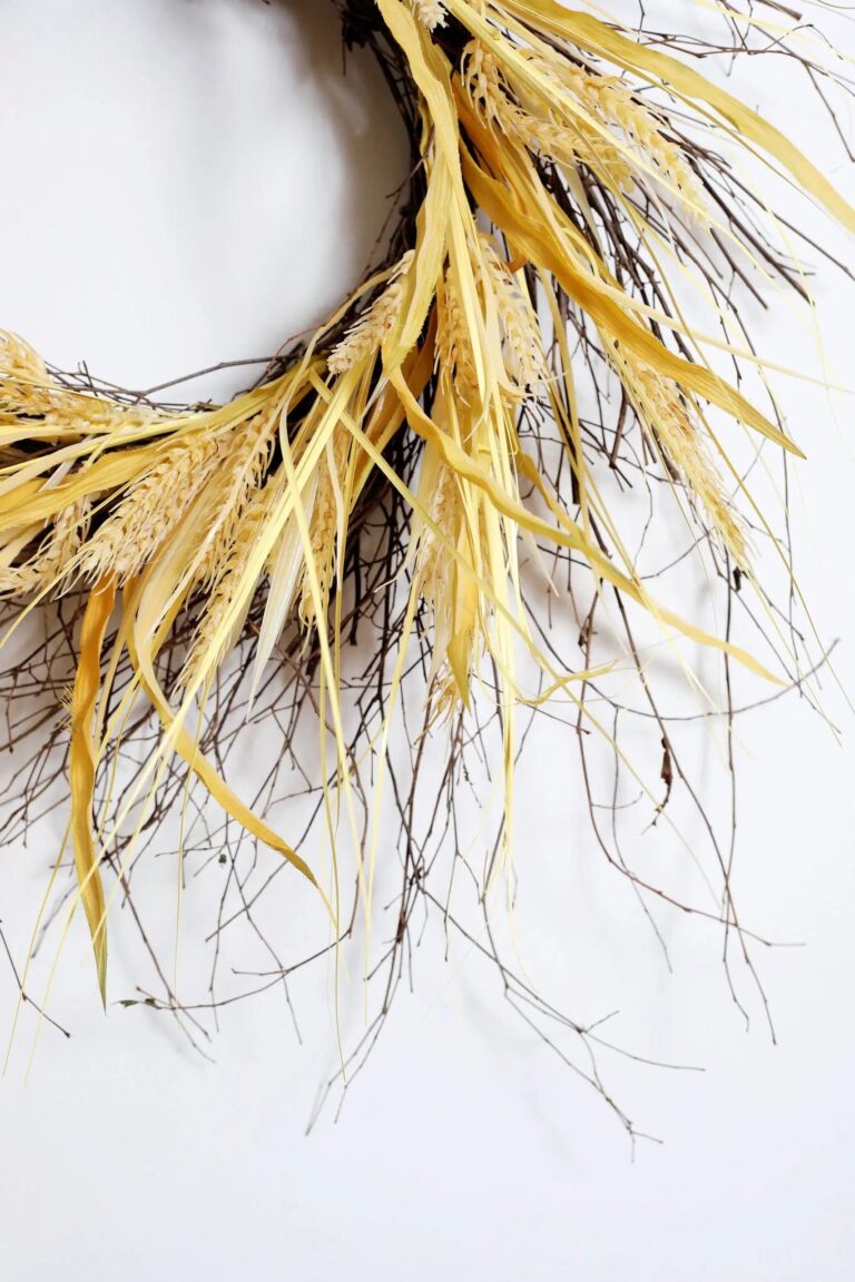 Close-up of blooms and berries on this Fall Wheat and Wispy Birch Front Door Wreath