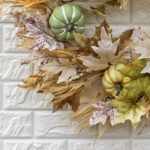 Alternate angle of the Neutral Autumn Leaf, Pumpkin Front Door Wreath showing wreath face texture