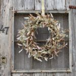 Alternate angle of the Cream Dried - Look Olive Door Fall Wreath showing wreath face