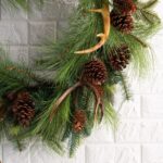 Side view of the Northern Elk Faux Antler Door Holiday Wreath revealing frame and backing