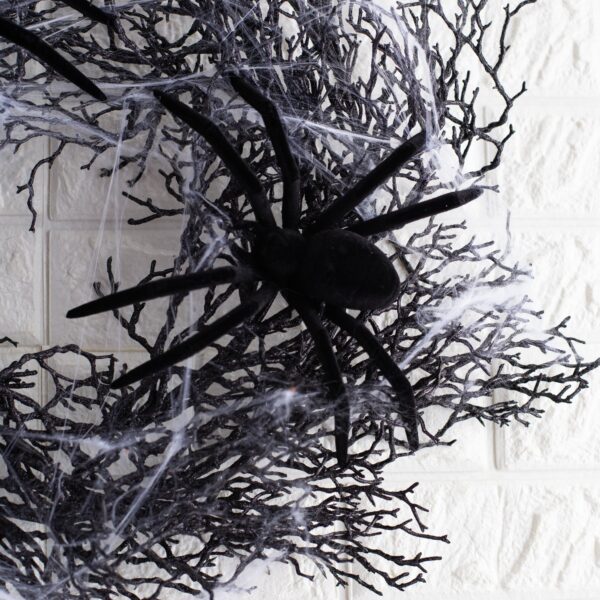 Close-up of blooms and berries on this The Black Widow - Glitter Spider Halloween Wreath