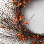 Close-up of blooms and berries on this Wild Bittersweet Berry and Twig Front Door Wreath