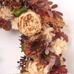 Close-up of blooms and berries on this Cashmere Radiance - Cafe au Front Door Wreath