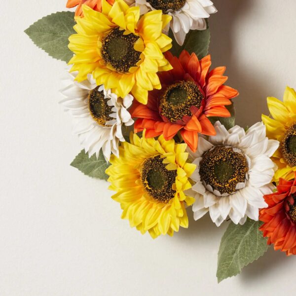 Close-up of blooms and berries on this Autumn Medley of Yellow, Orange Door Fall Wreath