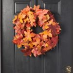 Alternate angle of the Red and Orange Autumnal Two Door Mantle Wreath showing wreath face