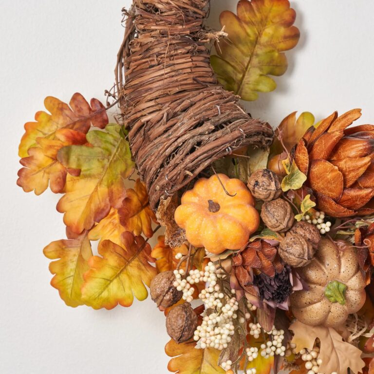 Close-up of blooms and berries on this Harvest Homecoming - Artichoke, Pumpkin, Thanksgiving Cornucopia Wreath
