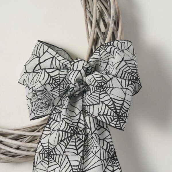 Close-up of blooms and berries on this White Washed Wicker Willow Wreath Spiderweb Halloween Bow