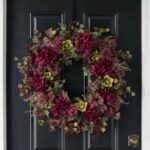 Detail view of layered greenery detail from the Merlot Ivy Medley with Fall Front Door