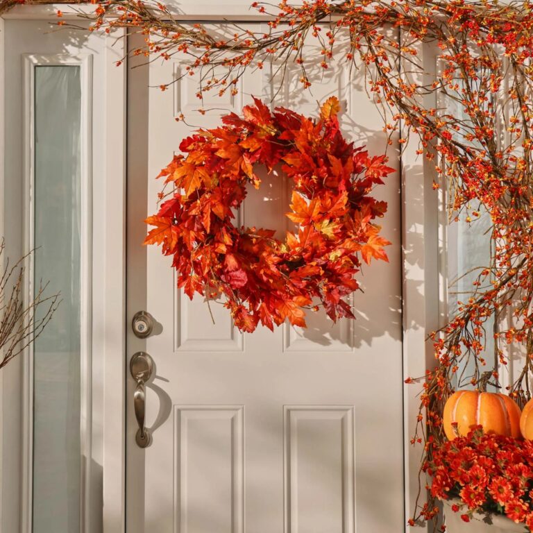 Close-up of blooms and berries on this Autumn Blaze Red Maple Door Mantel Wreath