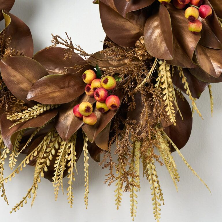 Close-up of blooms and berries on this Magnolia Fields of Gold Front Door Fall Wreath