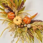 Close-up of blooms and berries on this Orange Pumpkin Spice - Fall Front Door Wreath