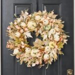 Detail view of layered greenery detail from the Blushing Autumn - Mixed Cream Front Door