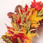 Close-up of blooms and berries on this Fall Medley - Red Orange Front Door Wreath