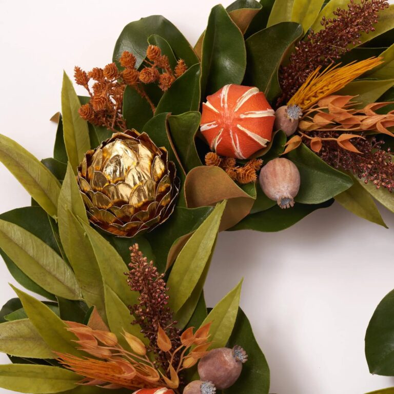 Close-up of blooms and berries on this Chateau Harvest - Dried Look Front Door Wreath