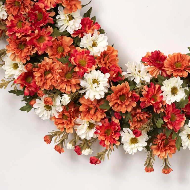 Close-up of blooms and berries on this Zinnia Mum Cream, Orange Floral Thanksgiving Wreath