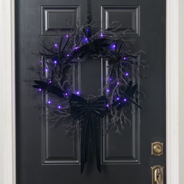 Close-up of blooms and berries on this Creatures of the Night Fall Halloween Wreath