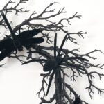 Side view of the Creatures of the Night Fall Halloween Wreath revealing frame and backing
