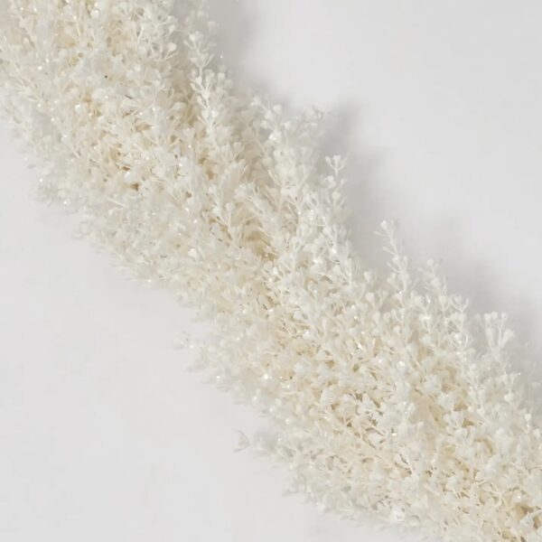 Close-up of greenery along the garland on this Frosted Shimmer Cream Baby's Breath Christmas Mantel