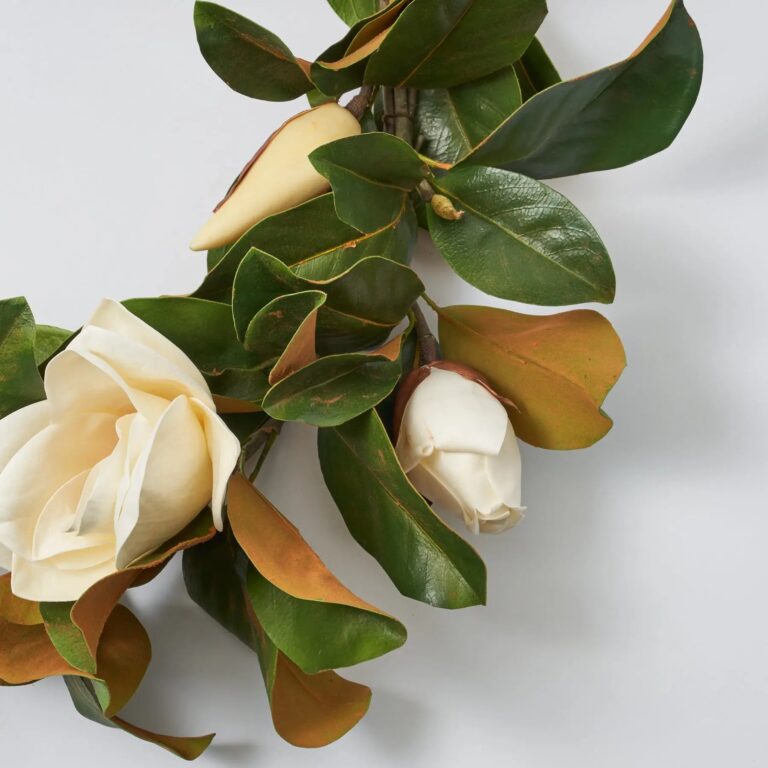 Close-up of greenery along the garland on this Real Touch White Magnolia Flower All Seasons