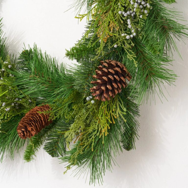 Close-up of greenery along the garland on this Classic Holiday Greens and Pinecone Front Door