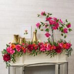 Alternate angle of the Climbing Real Touch Cerise Pink Spring Table Arrangement showing bloom arrangement