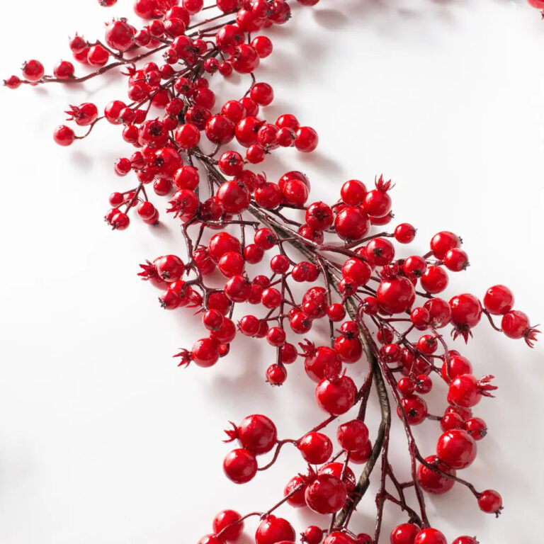Close-up of greenery along the garland on this Waterproof Red Berry Christmas Holiday Holiday Mantle