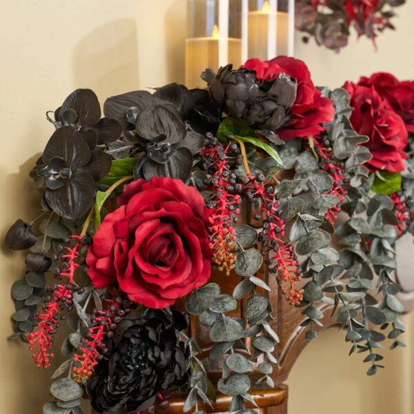Close-up of greenery along the garland on this Gothic Romance - Red Queen Runner Mantel