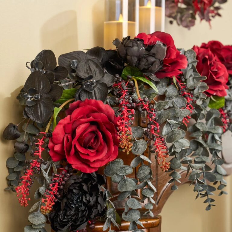 Close-up of greenery along the garland on this Gothic Romance - Red Queen Runner Mantel